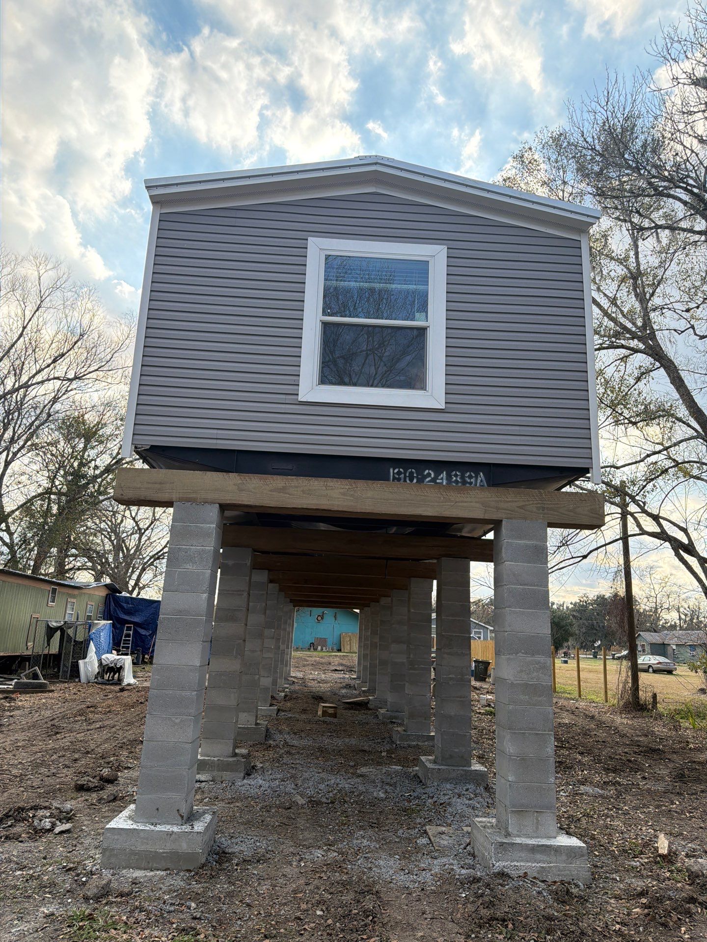House raised on concrete pillars - LRS LLC Louisiana