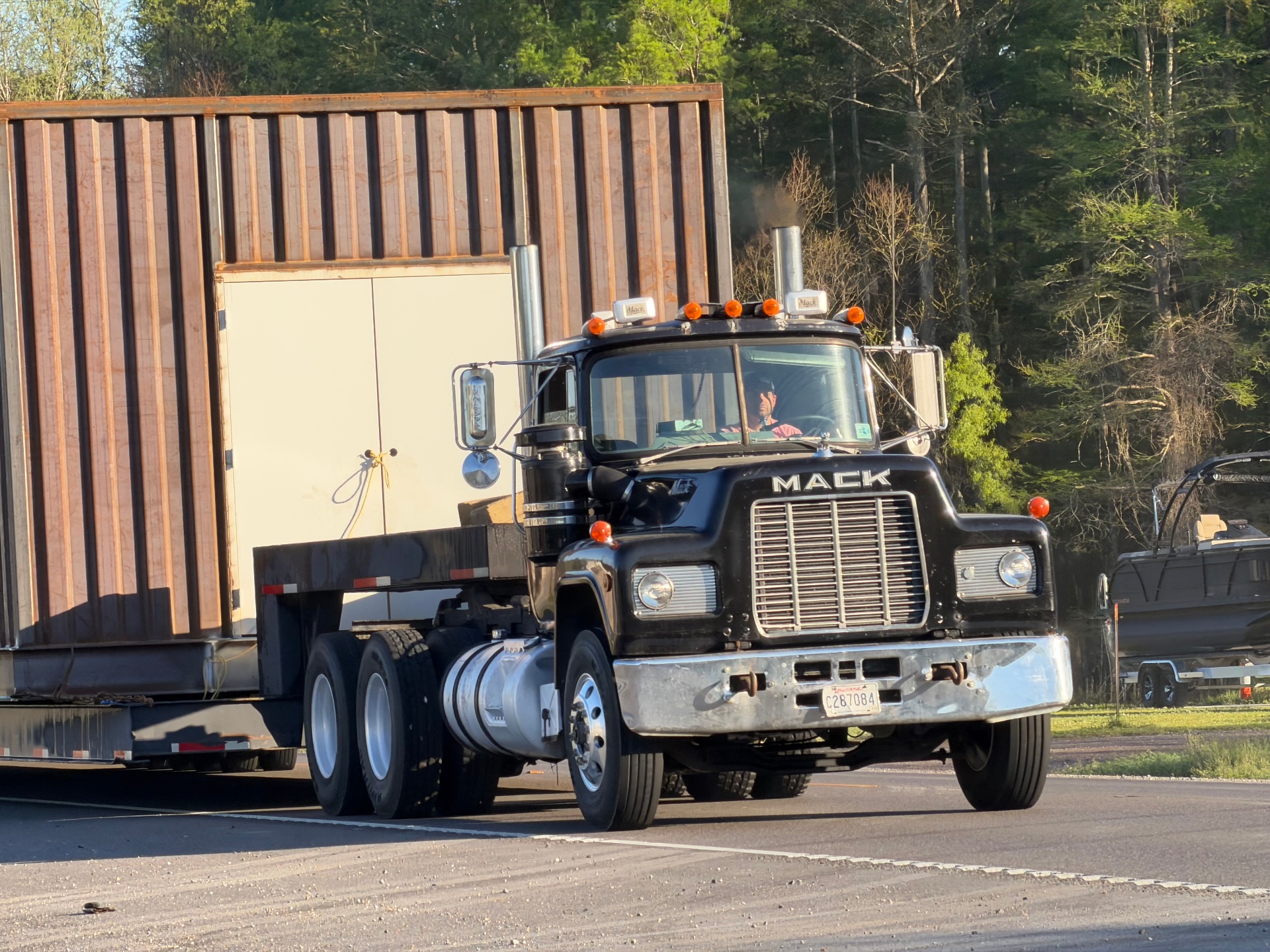 Mack truck hauling house - LRS LLC